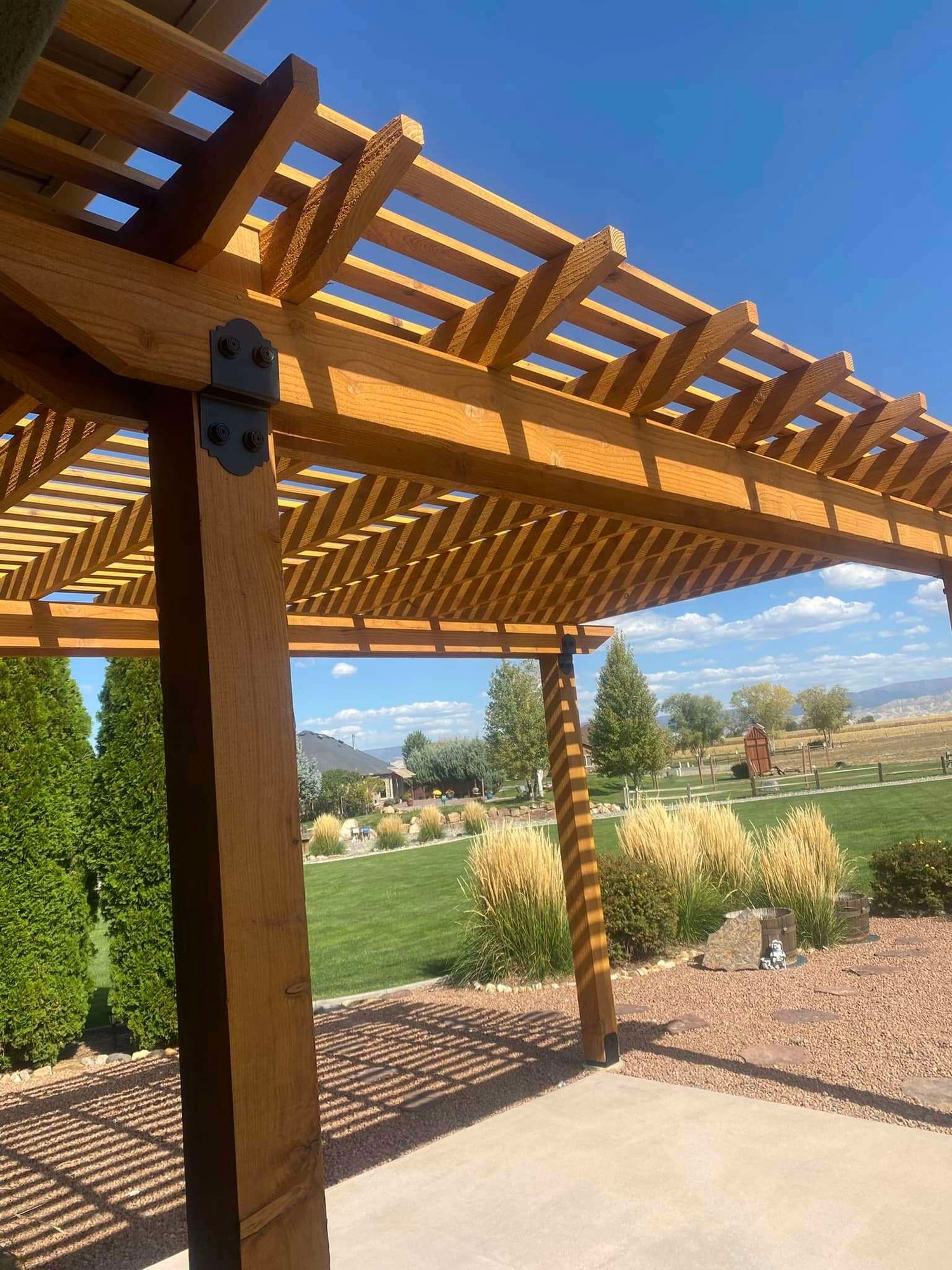 Custom built wooden pergola designed to enhance outdoor living space, crafted by LLP Home Renovation